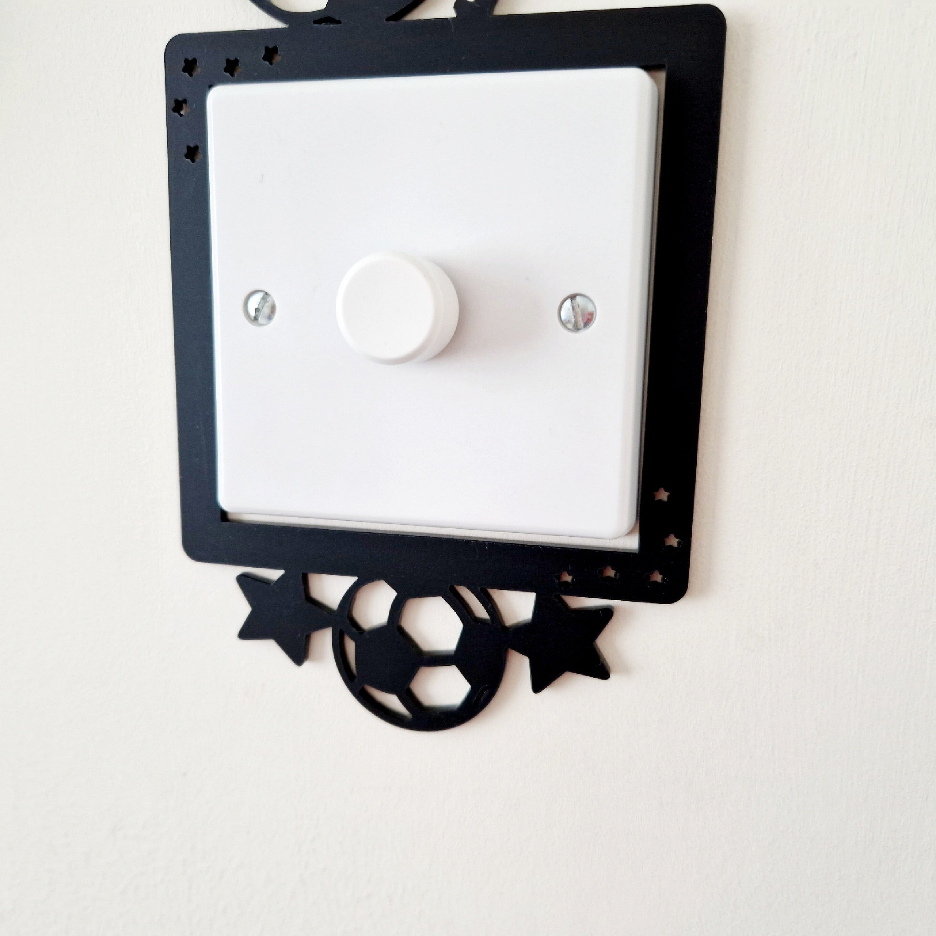 Decorative black light switch cover with football design