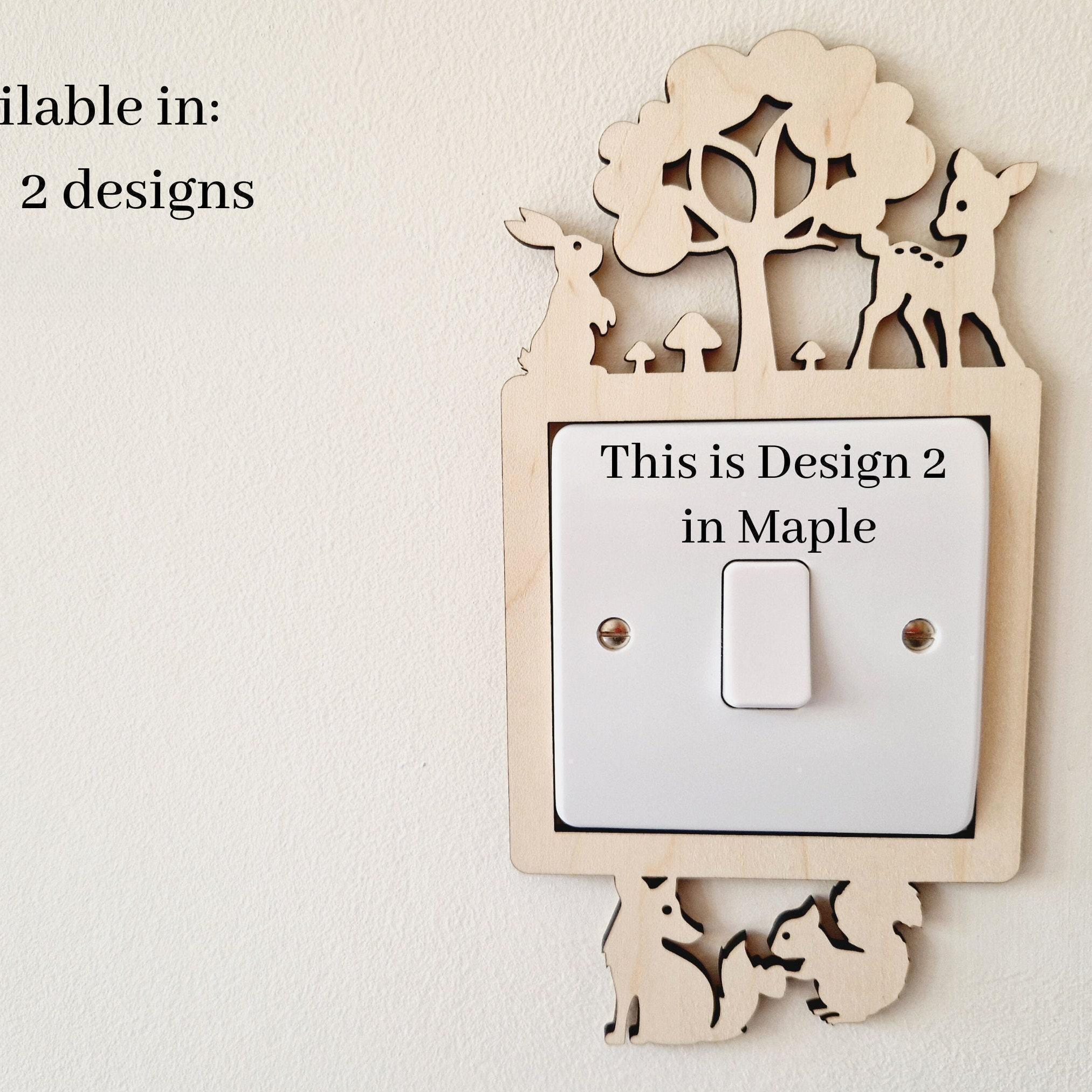 a wooden light switch with a decorative design on it, mounted on a wall.