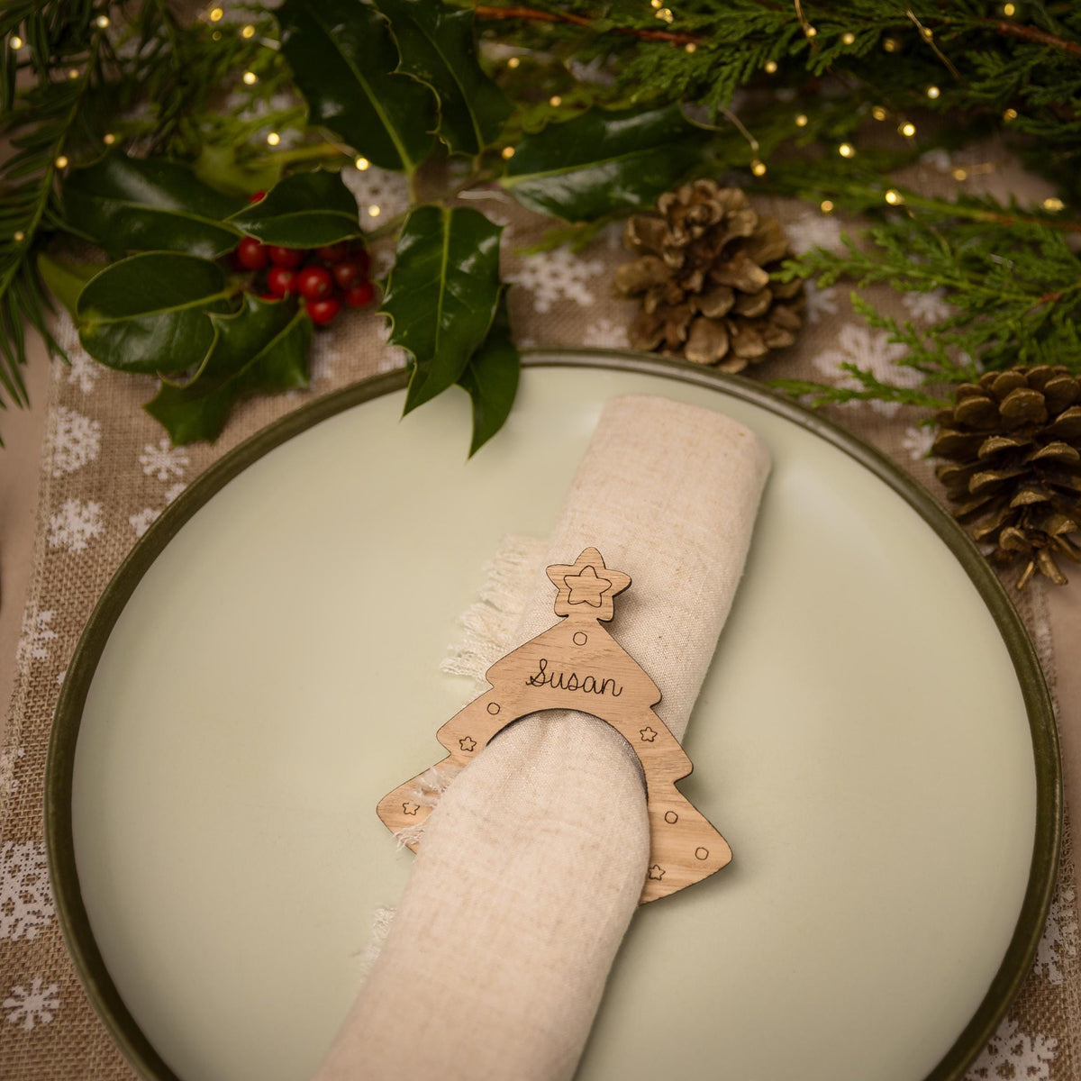 Wooden napkin ring with christmas tree design.
