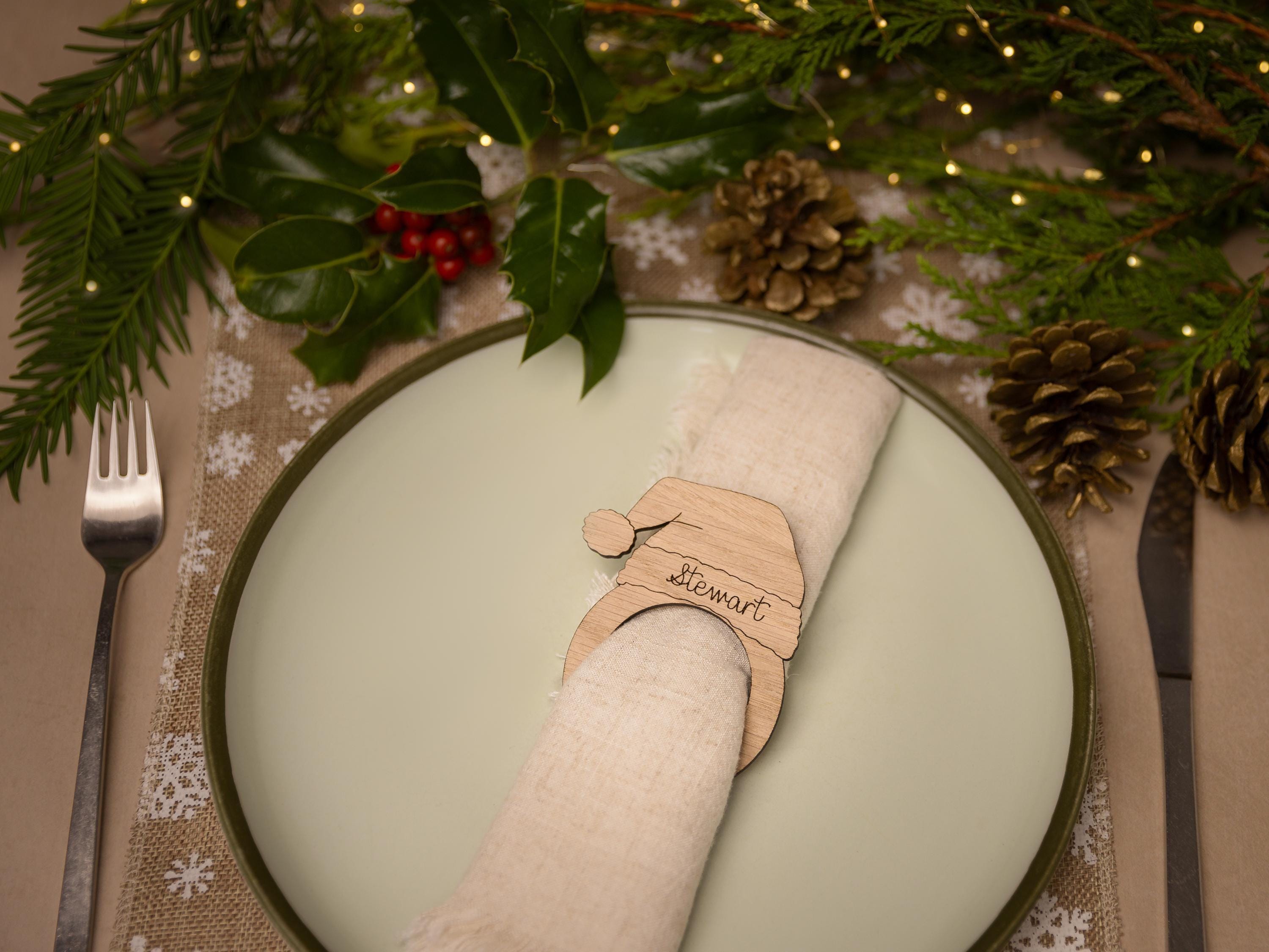 Wooden napkin ring with santa hat design.