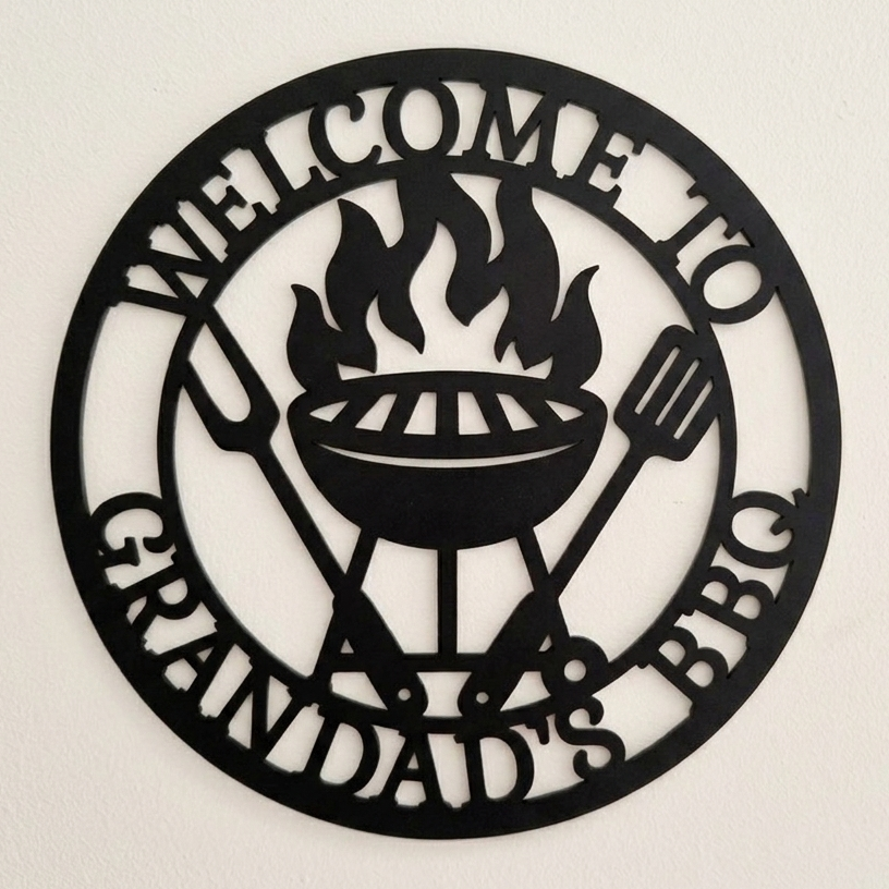 Decorative acrylic sign with 'Welcome to Grandad's BBQ' text and grill design on a beige background