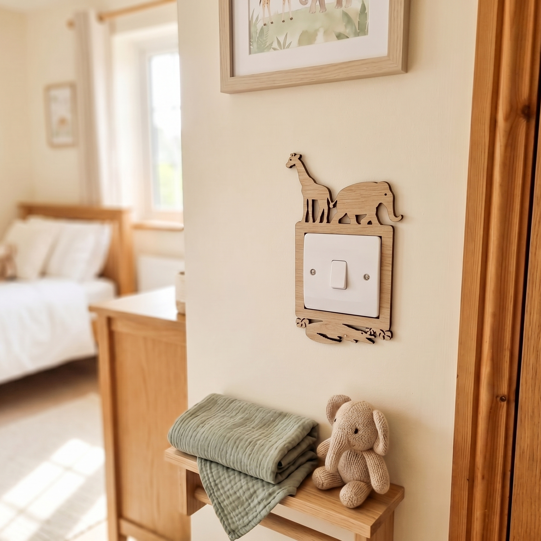 A safari themed children's room with wooden light switch surround featuring safari animal shapes.