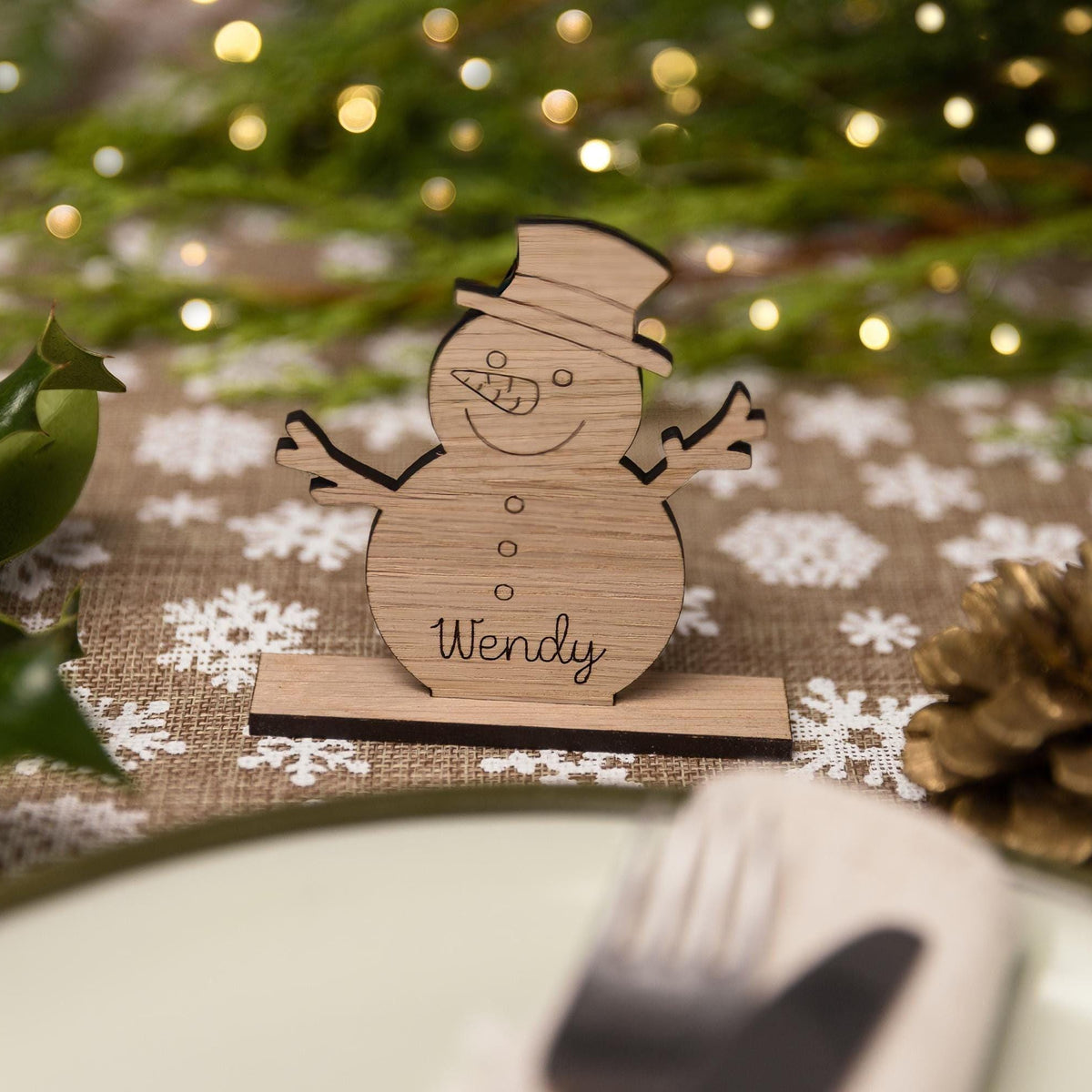 Standing snowman wooden place name setting