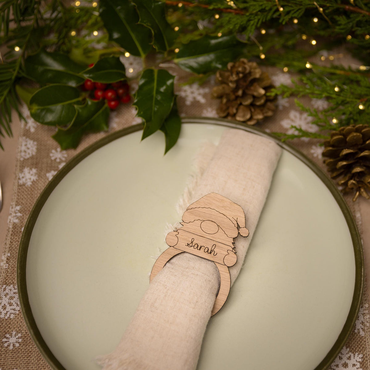 Wooden napkin ring with gonk design.