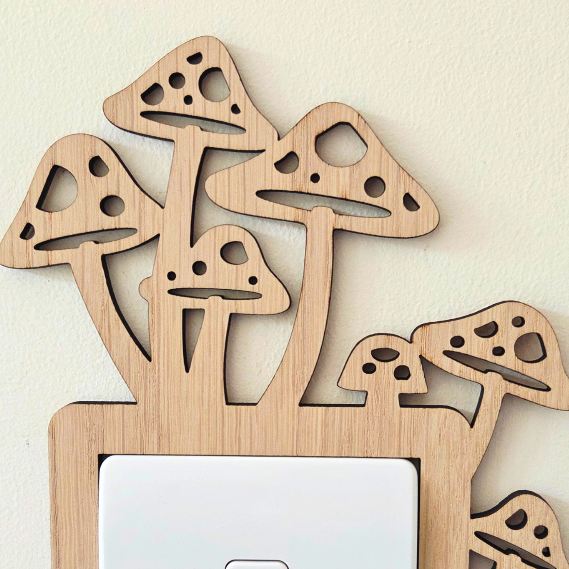 A wooden mushroom-shaped light switch cover is mounted on a wall.