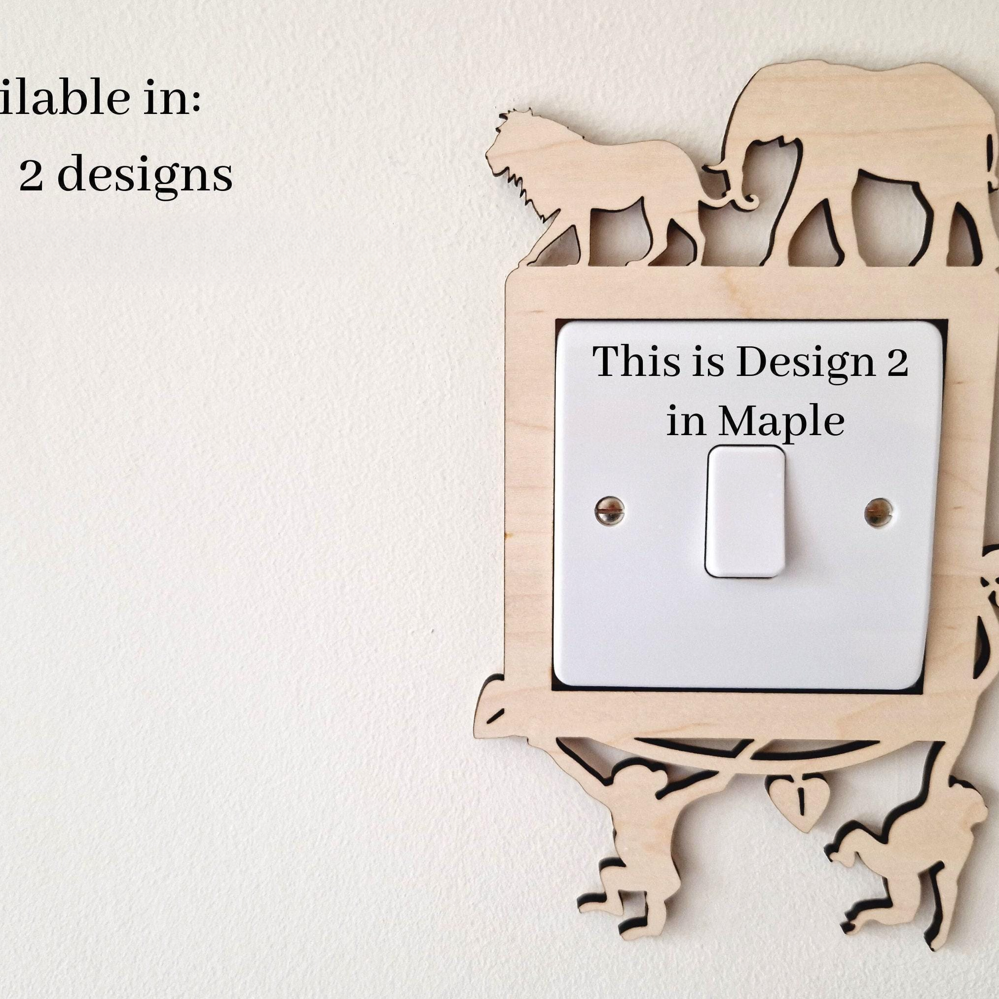 a wooden light switch with a design of an elephant and a lion on it, along with a description of the design.