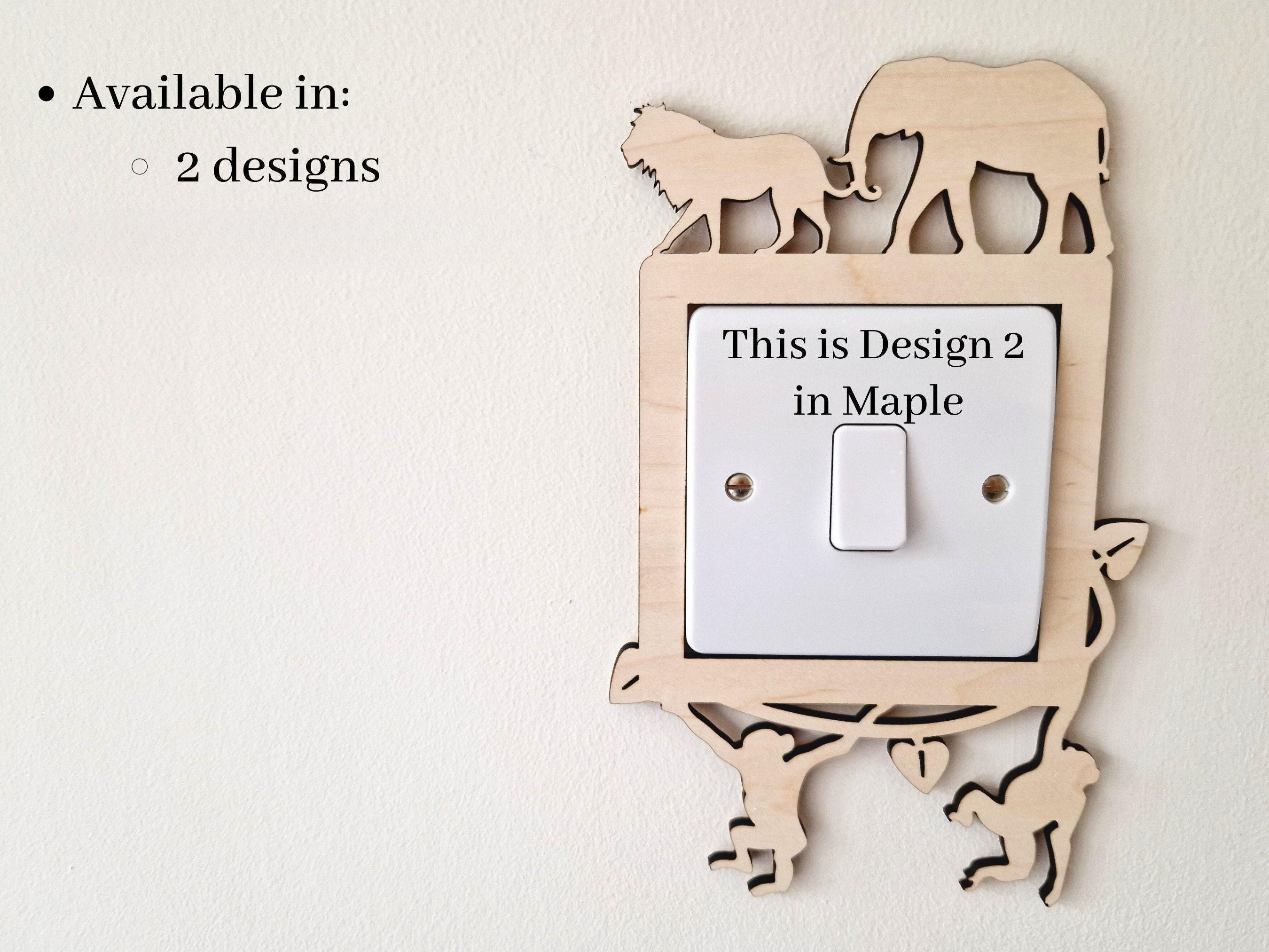 a wooden light switch with a design of an elephant and a lion on it, along with a description of the design.