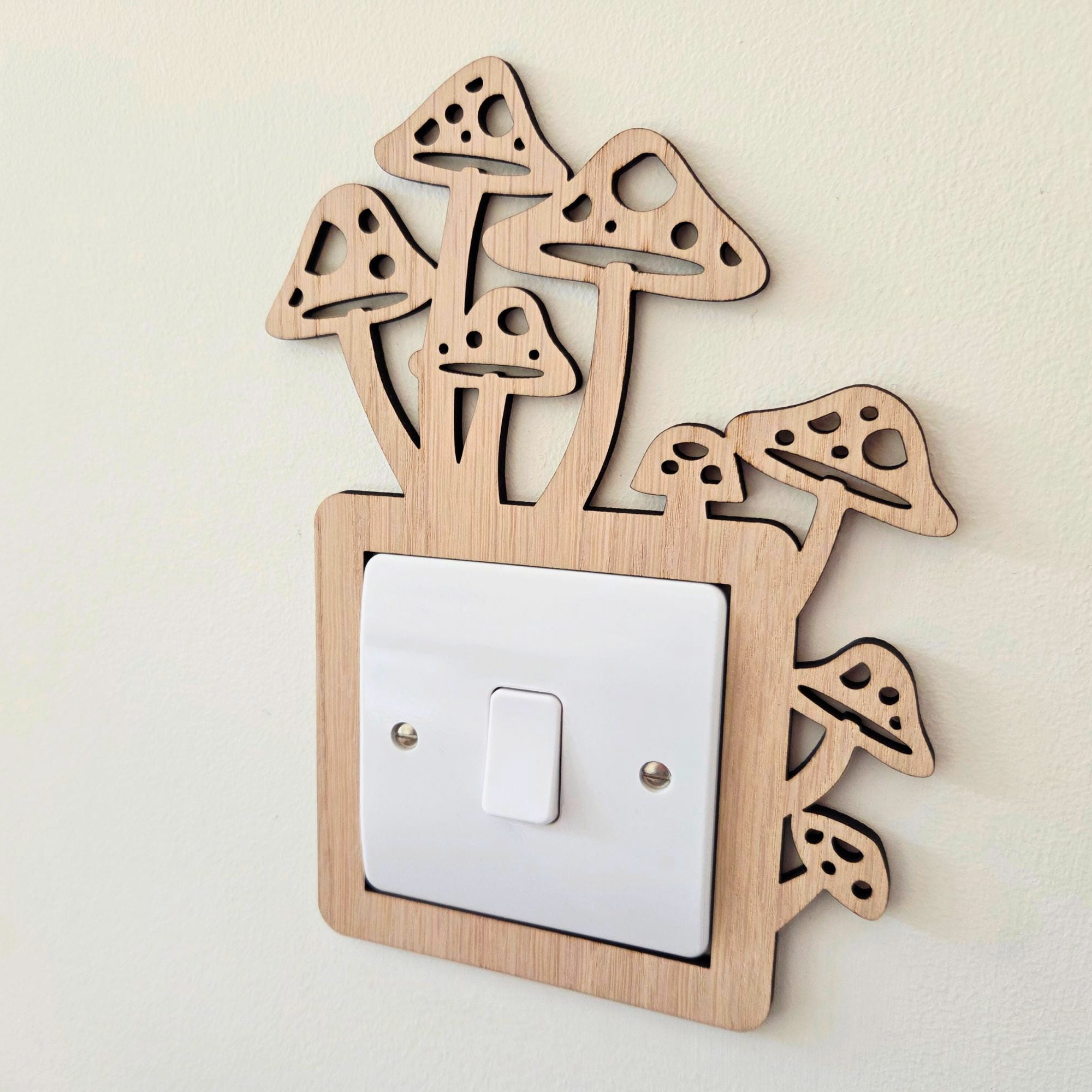 A wooden mushroom-shaped light switch on a wall.