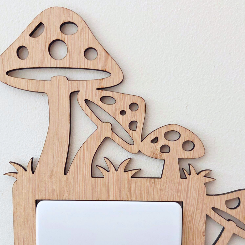 A wooden mushroom-shaped light switch on a wall.