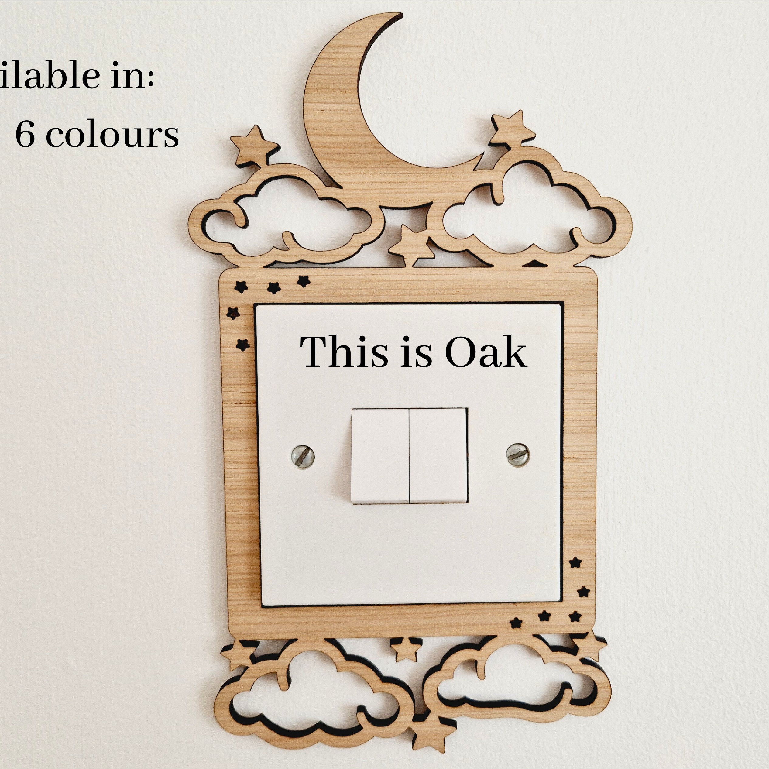 a wooden light switch with a moon and star design, and the text "This is Oak" is displayed on the switch.