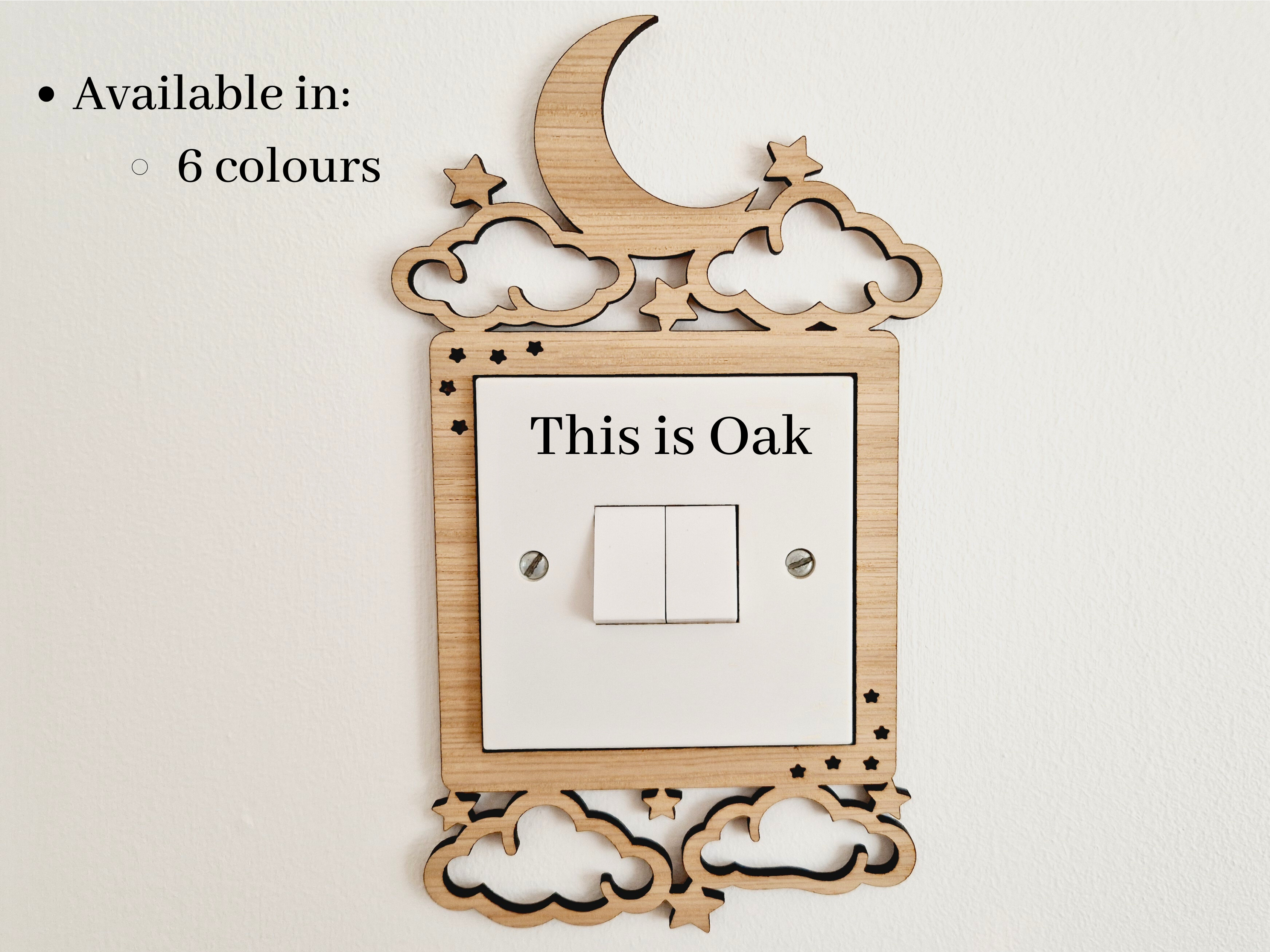 a wooden light switch with a moon and star design, and the text "This is Oak" is displayed on the switch.