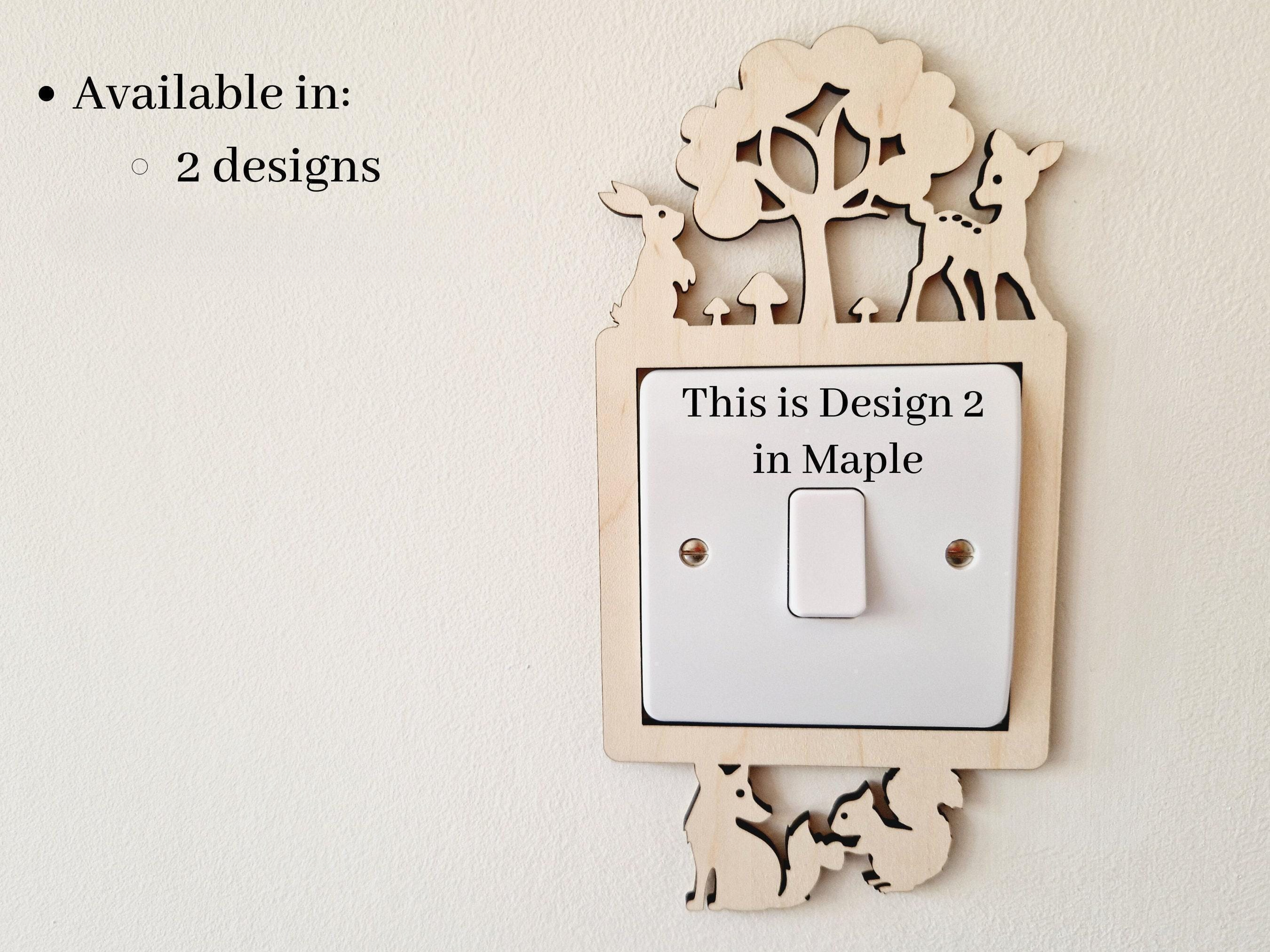 a wooden light switch with a decorative design on it, mounted on a wall.