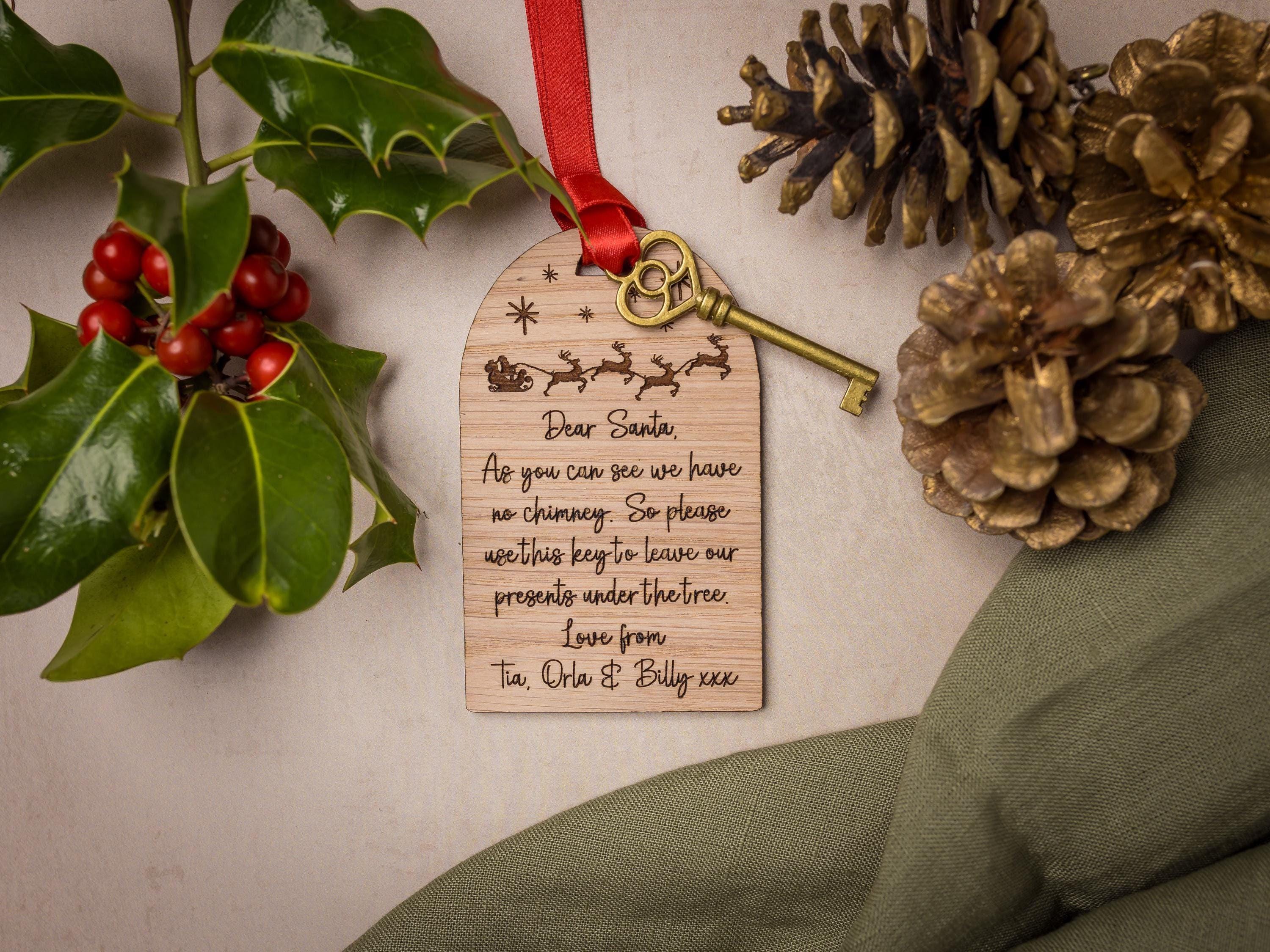 Wooden engraved santa key fob and golden key.