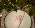 Wooden napkin ring with a snowman  design.