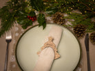 Wooden napkin ring with christmas tree design.