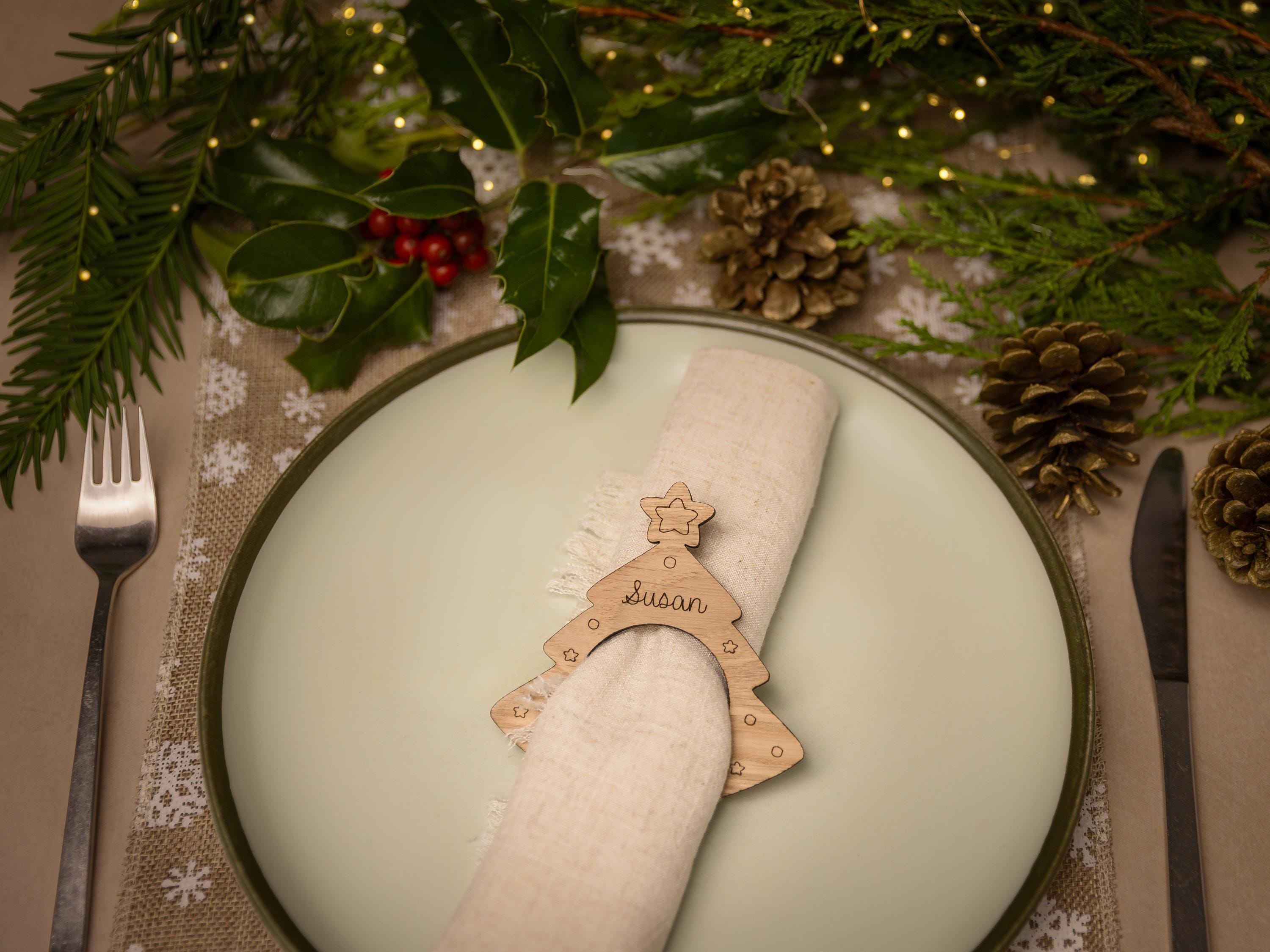 Wooden napkin ring with christmas tree design.