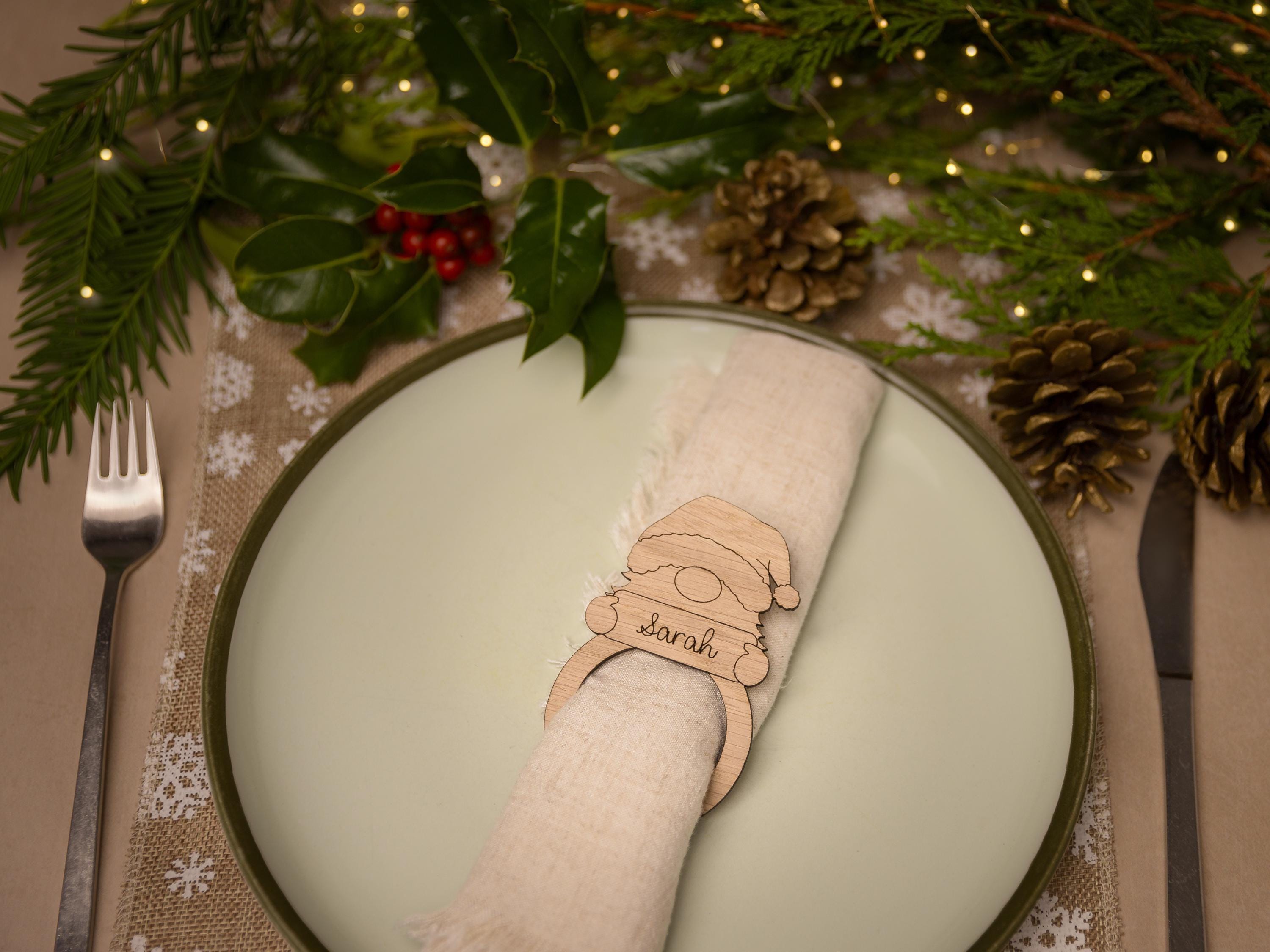 Wooden napkin ring with gonk design.