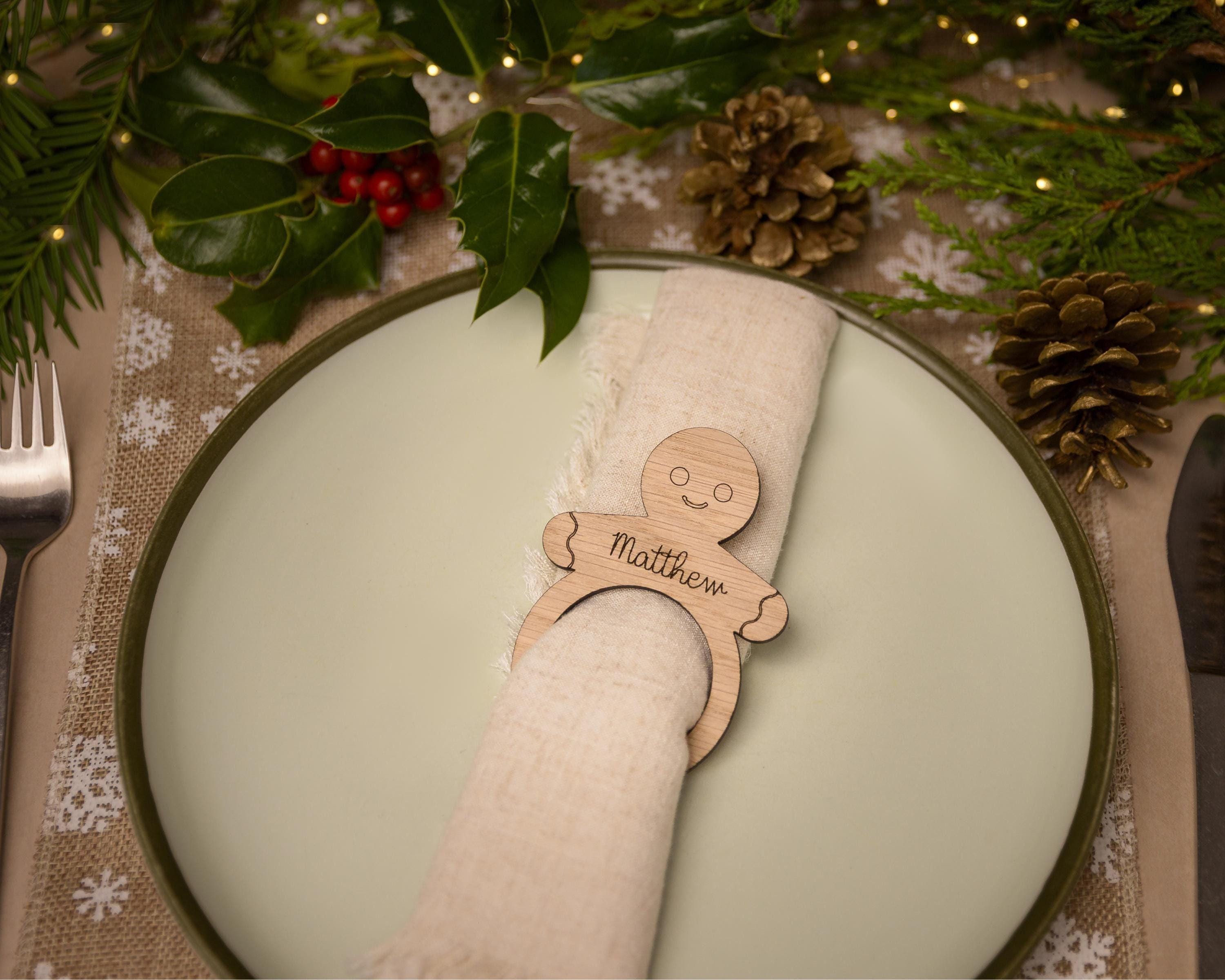 Wooden napkin ring with a gingerbread man design.