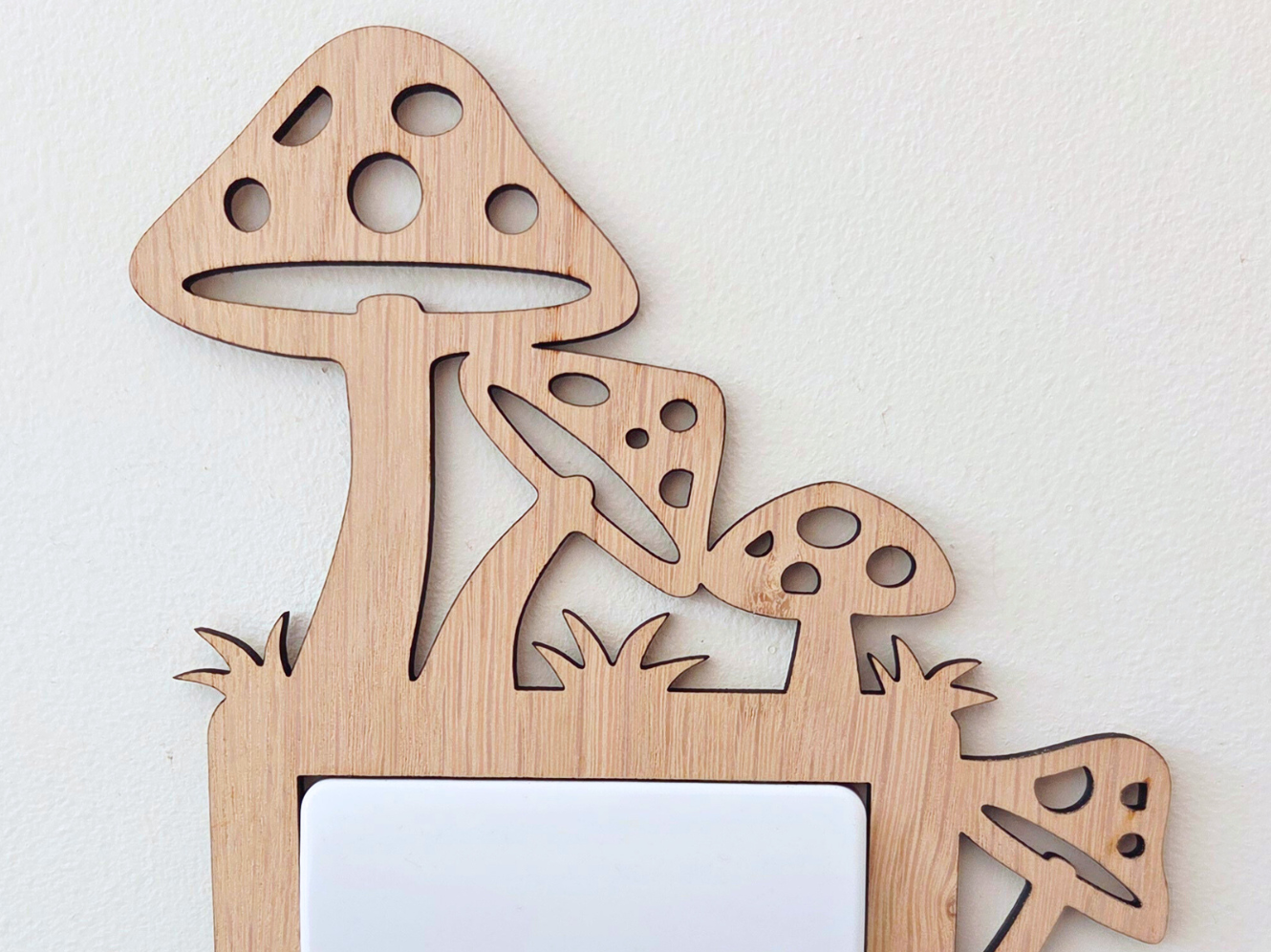 A wooden mushroom-shaped light switch on a wall.