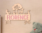 Wooden name sign with woodland animals.