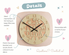 The image is a detailed description of a clock with a wooden and acrylic design, featuring a personalized name carved into the wood and a matching name carved into the acrylic. The clock is set against a light pink background with hearts and stars scattered around.