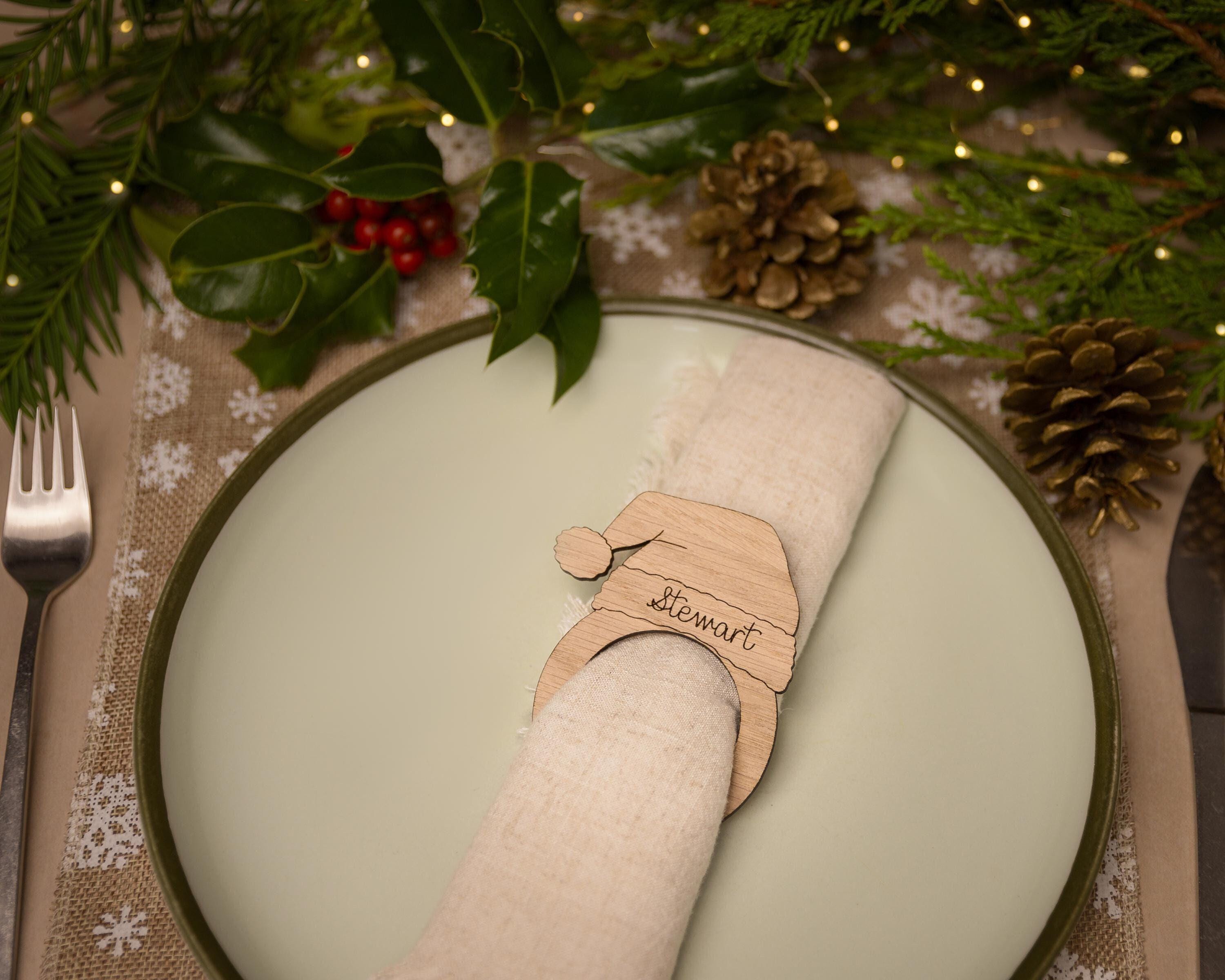 Wooden napkin ring with a christmas santa hat design.