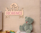Wooden name sign with woodland animals.